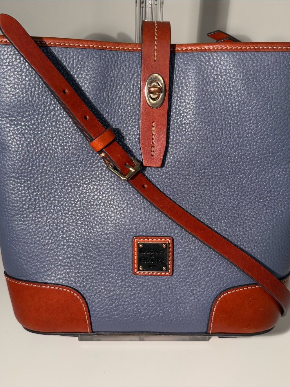 Dooney & Bourke Slate Blue Pebble Leather Crossbody Bucket Bag with Brown Trim